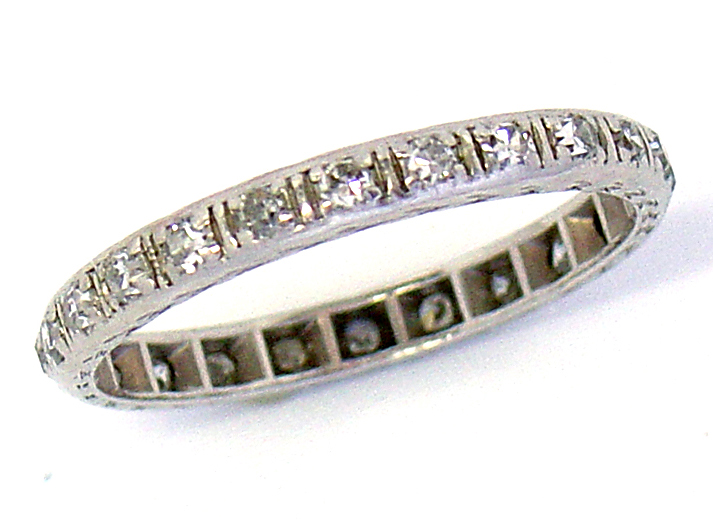 Hand crafted platinum band set with 24 old mine single cut diamonds
